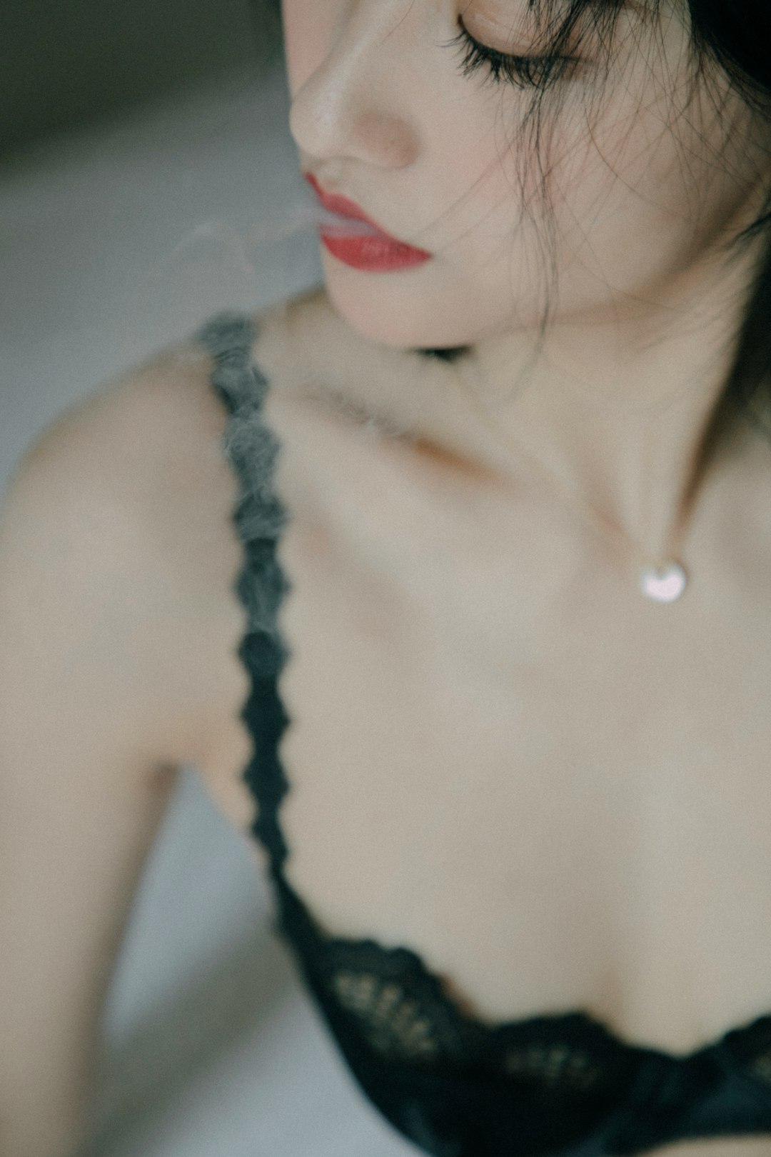 woman-exhales-smoke-from-her-mouth-n5rd0uwmn3c